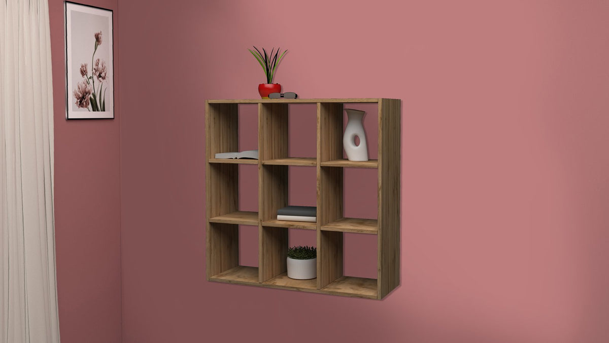 Libreria a muro ECHO rovere a nove vani su parete rosa con vasi e libri