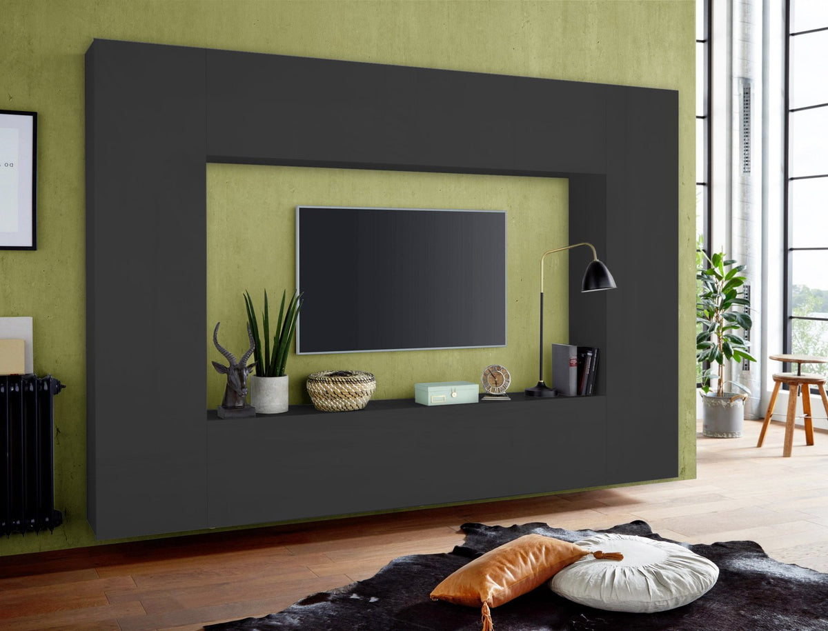 Parete attrezzata ECHO antracite opaco di tre quarti in soggiorno con parete verde #colore_Antracite Opaco