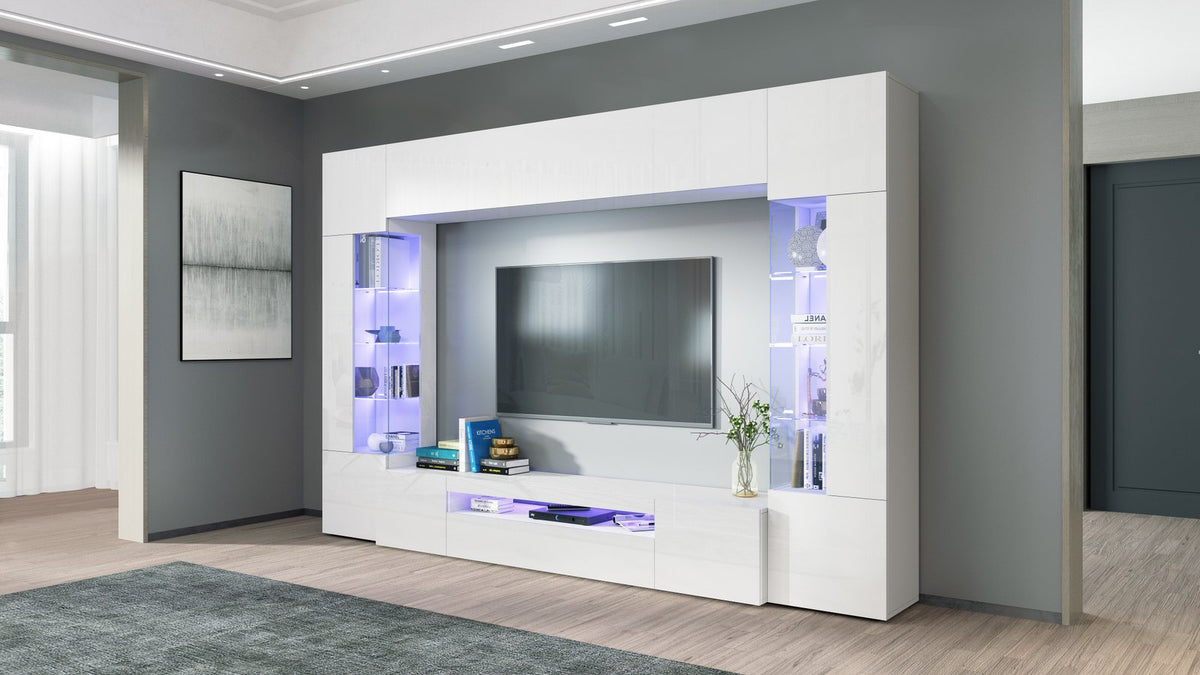Parete attrezzata QUANTUM bianco lucido con vetrine a LED viola e ante a ribalta chiuse #colore_Bianco Lucido