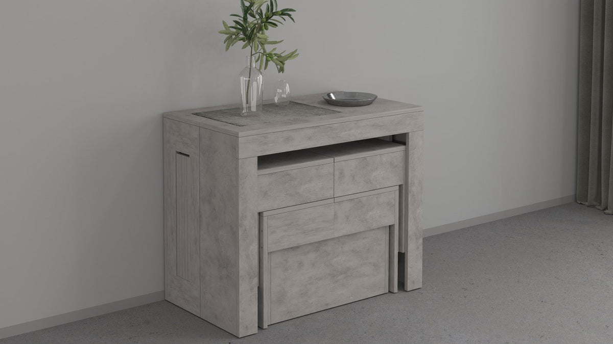 Consolle ORION cemento bronx chiusa, vista di tre quarti con centrotavola e vaso di rami #colore_Cemento Bronx