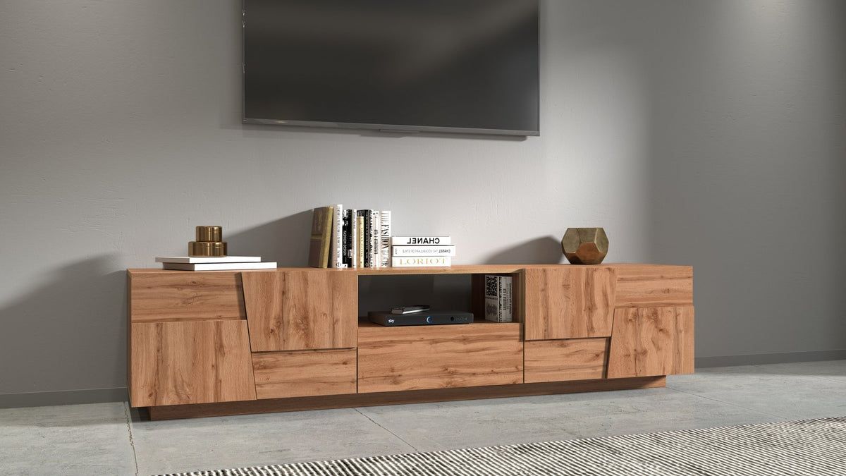 Porta TV INFINITY rovere in ambiente interno con lettore DVD, libri e TV a parete #colore_Rovere