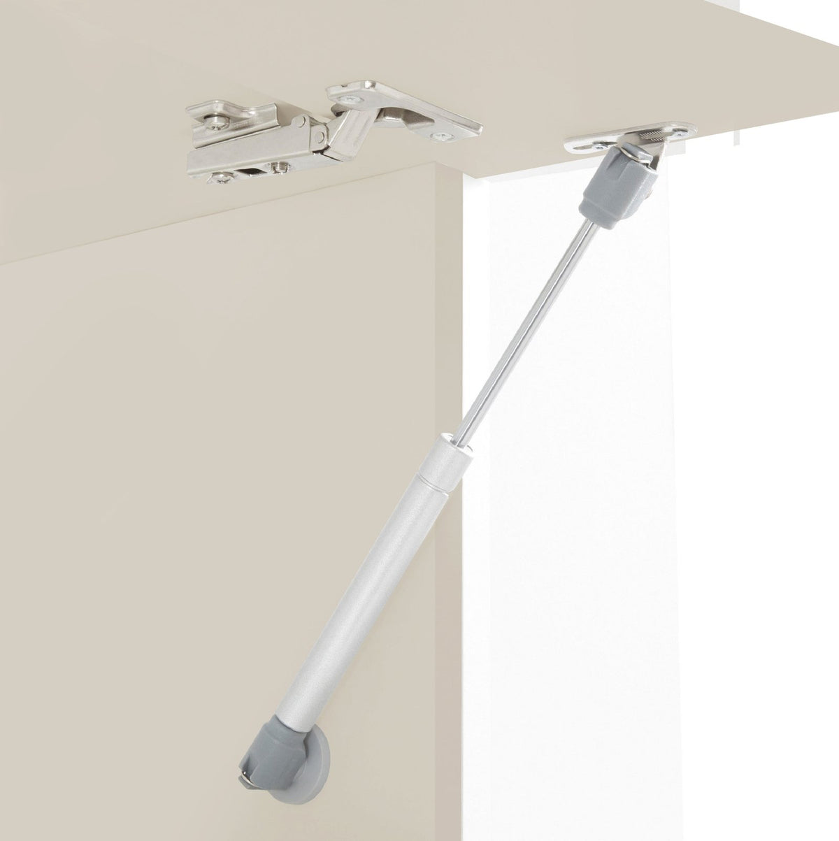 Dettaglio del pistone a gas e delle cerniere nichelate di un mobile STELLAR cashmere #colore_Cashmere