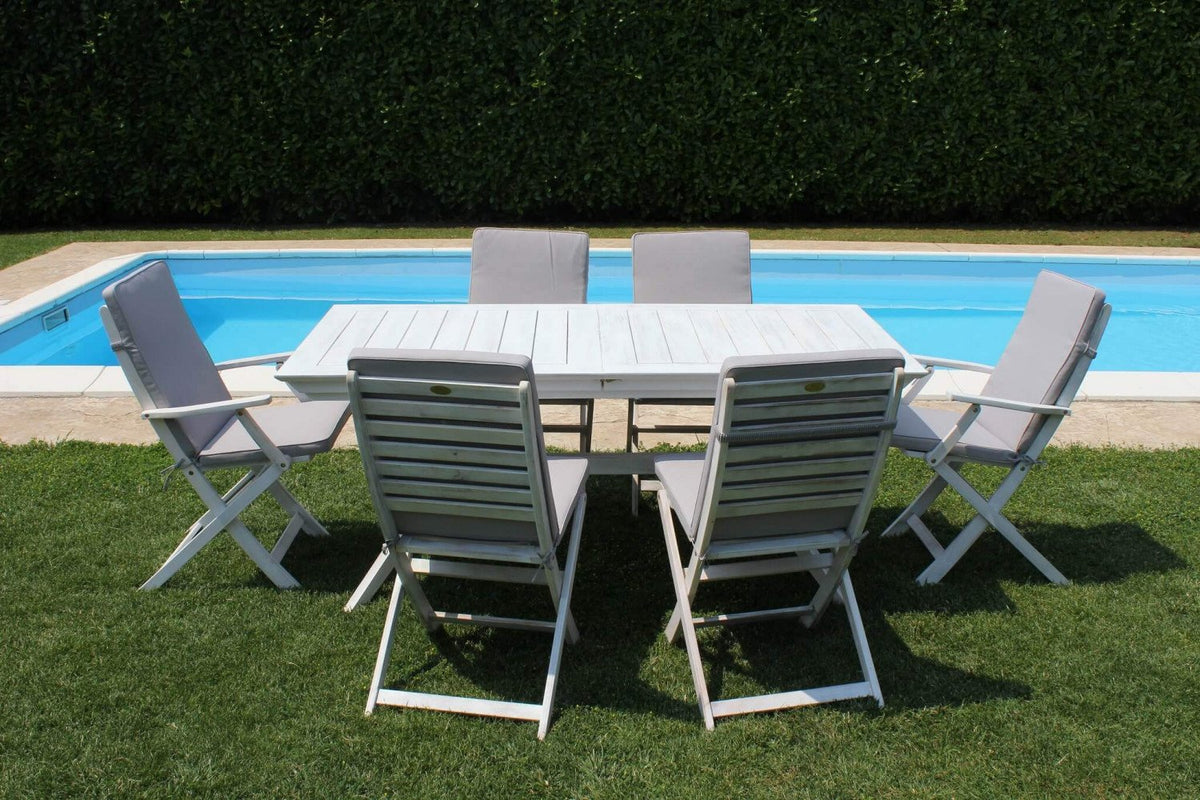 Tavolo da giardino LOMBOK bianco chiuso circondato da sei sedie reclinabili, vista laterale