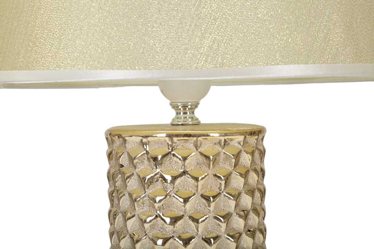 lampada_da_tavolo_ceramica_dorata_con_paralume_in_tessuto_bianco__glam_gold