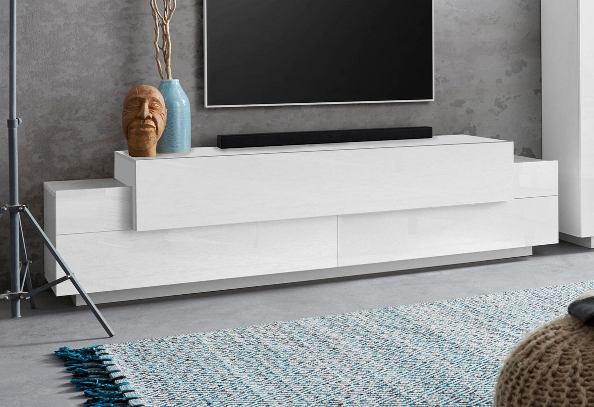 Porta TV CELESTIA bianco opaco in ambiente domestico con due livelli sfalsati #colore_Bianco Opaco/Bianco Lucido