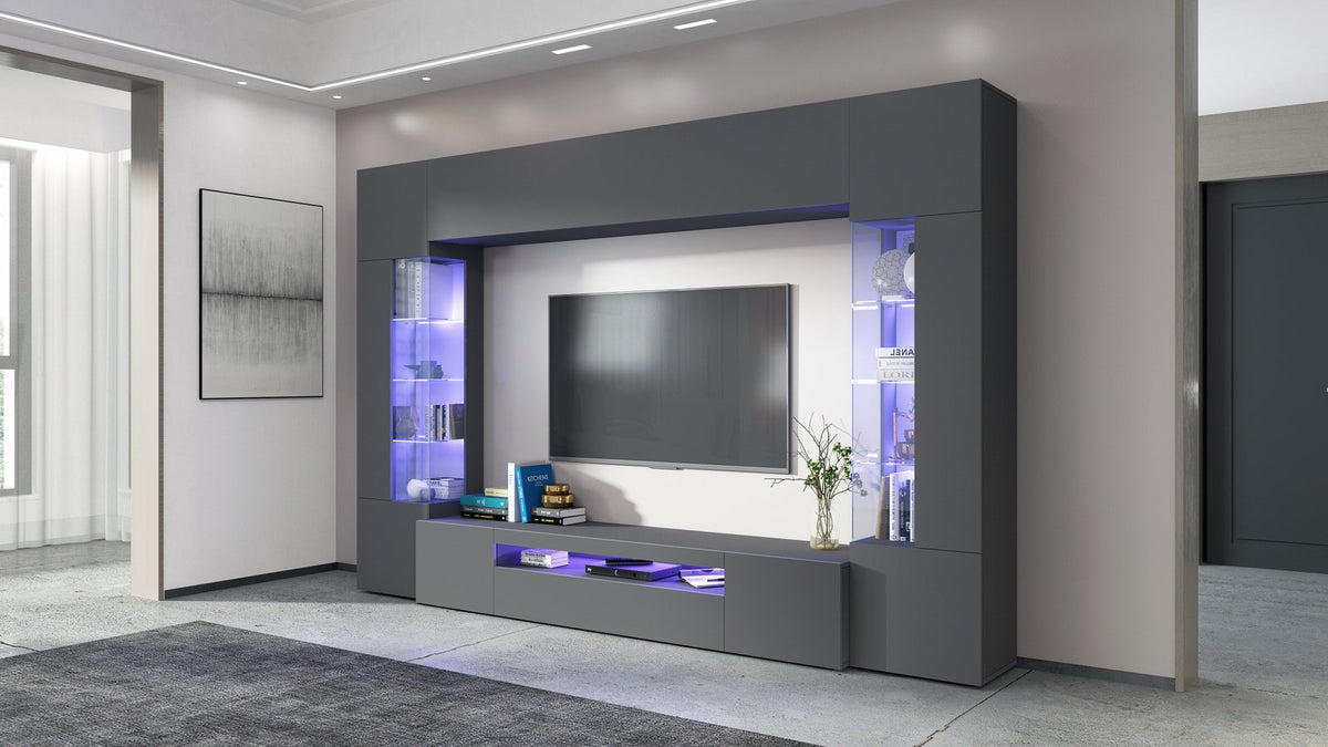 Parete attrezzata QUANTUM antracite opaco di tre quarti con vani LED blu in soggiorno #colore_Antracite Opaco