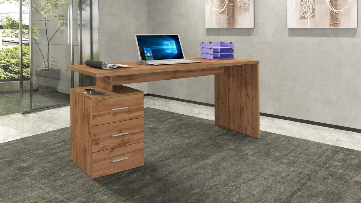 Scrivania NOVA rovere Wotan in ambiente interno con laptop aperto e cassettiera a tre cassetti #colore_Rovere Wotan