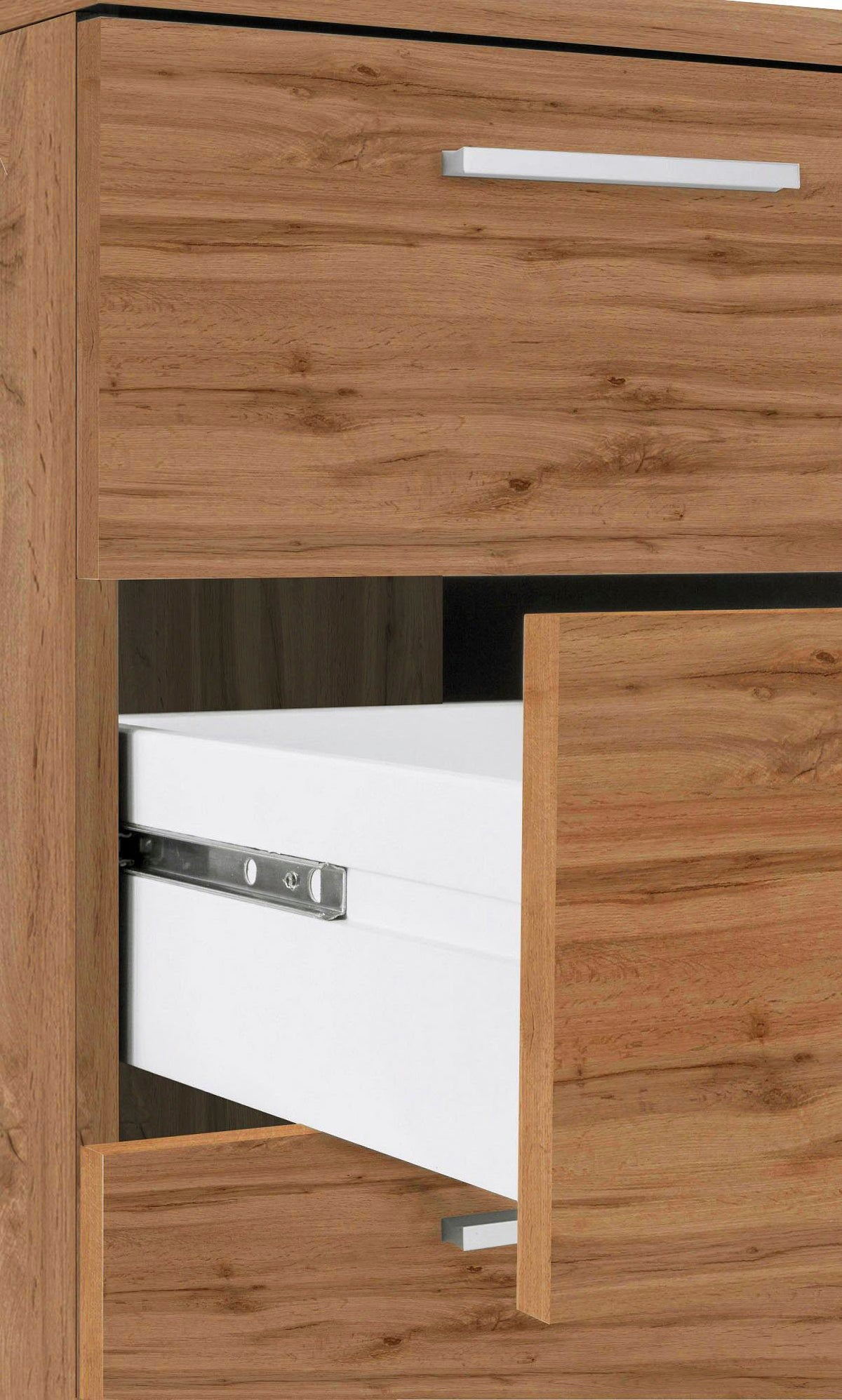 Dettaglio della cassettiera NOVA rovere Wotan con cassetto semiaperto e guida telescopica cromata #colore_Rovere Wotan