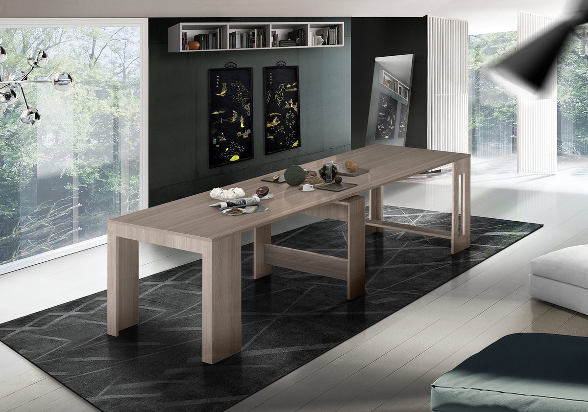Consolle ORION cemento allungata su tappeto grigio davanti a parete verde con pannelli neri #colore_Cemento