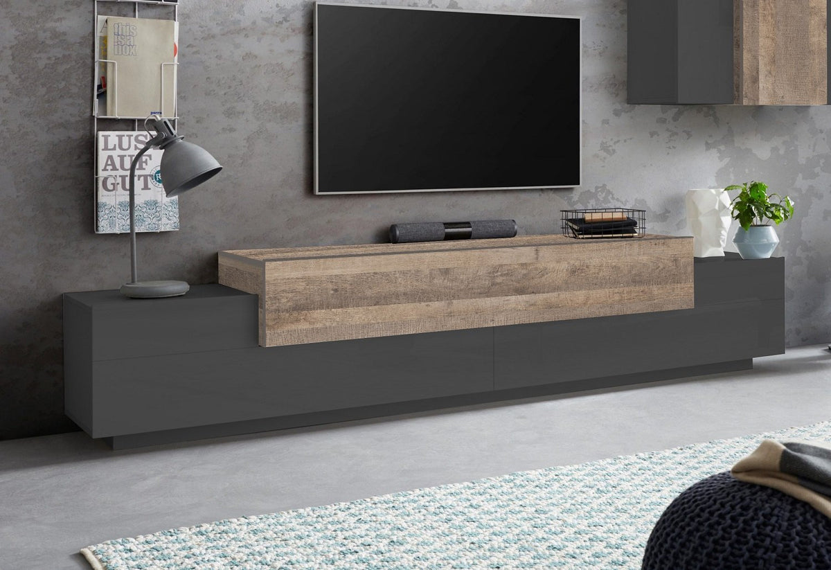 Porta TV CELESTIA antracite opaco e rovere in soggiorno con parete grigia effetto cemento #colore_Antracite Opaco/Rovere