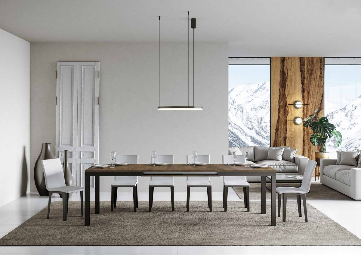 Tavolo EVERYDAY EVOLUTION noce aperto apparecchiato per sei, giunzione dell'allungamento al centro #colore_Noce