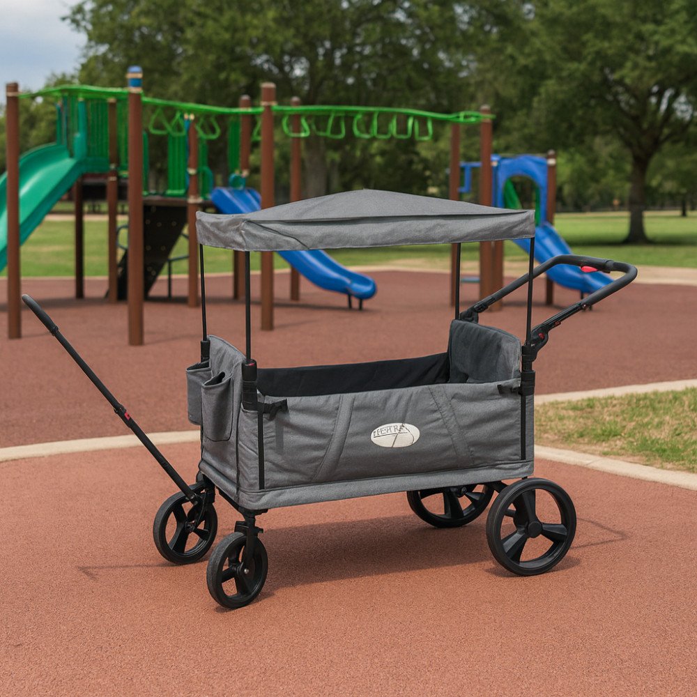 Carrello CARIBBEN grigio chiaro montato in un parco giochi, con barra di traino e ruote nere