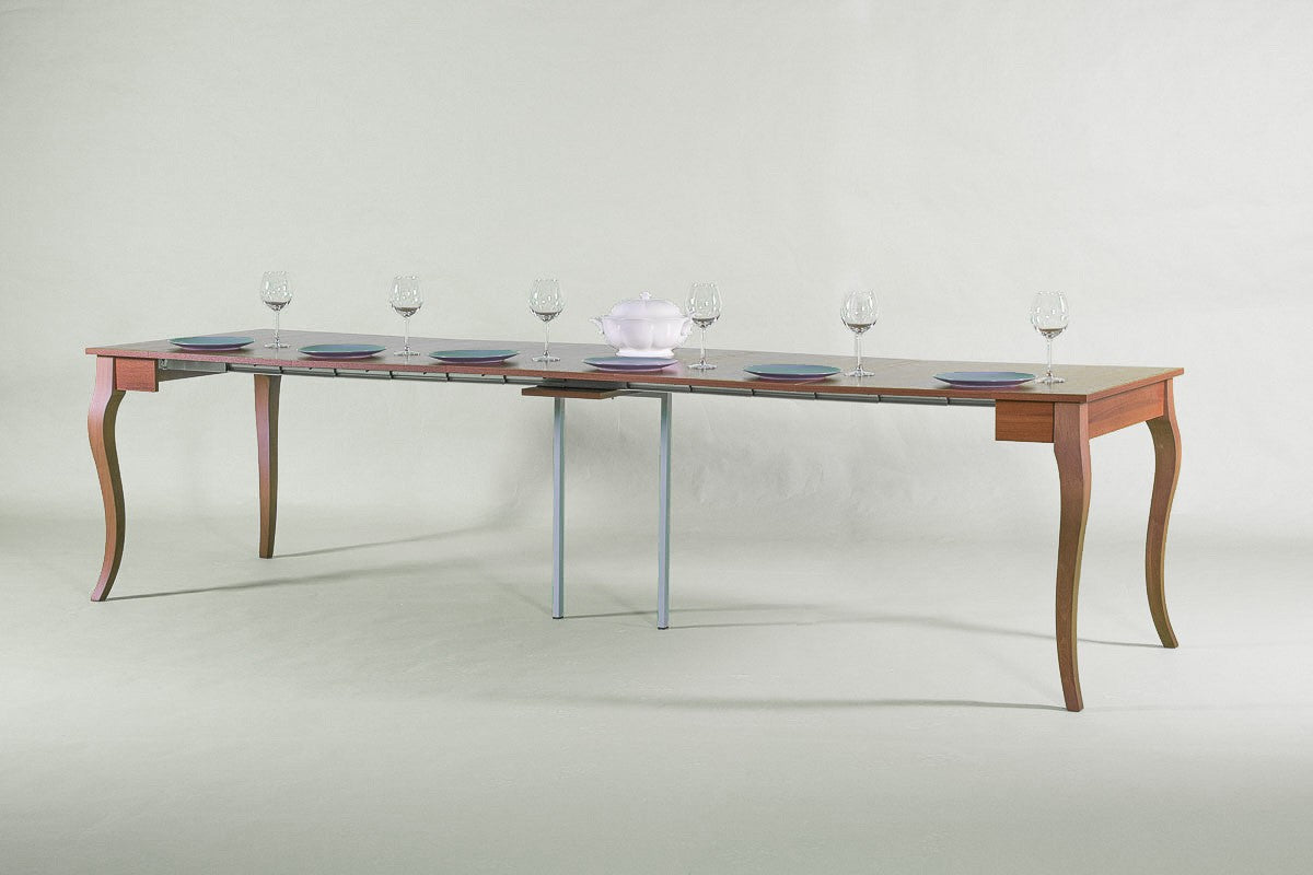 Consolle OLANDA noce aperta su sfondo grigio, con gambe metalliche nella sezione centrale allungata #colore_Noce