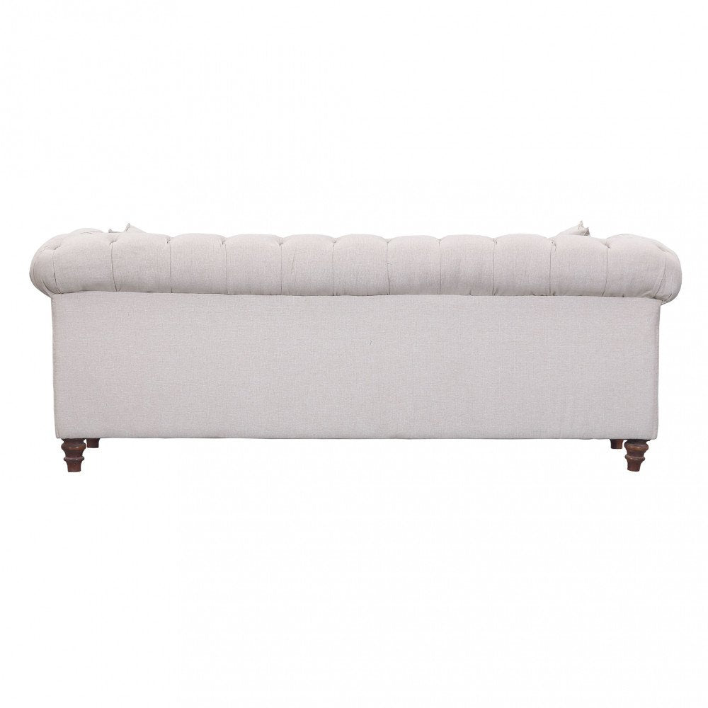 Divano MERCER beige visto dal retro con schienale a pannelli imbottiti su sfondo bianco