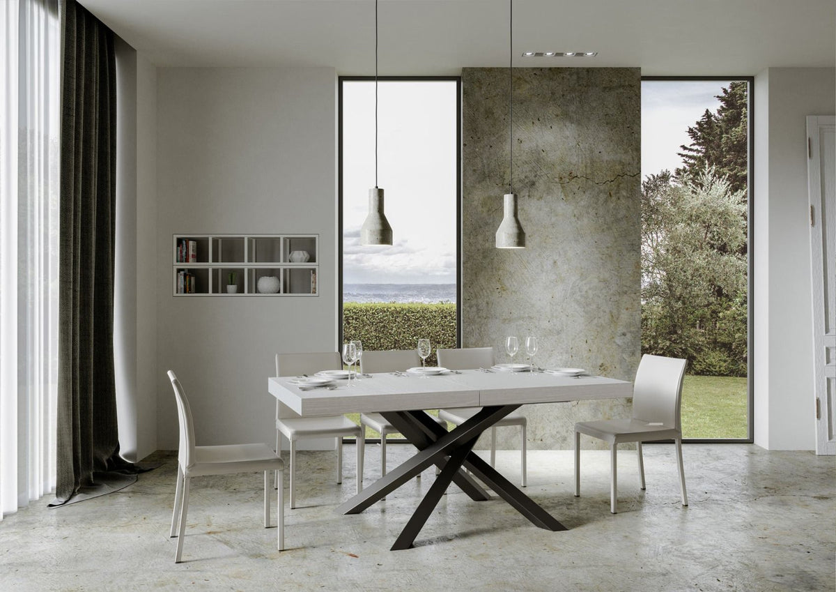 Tavolo VOLANTIS bianco frassino in sala moderna con sei sedie bianche e vista sul mare #colore_Bianco Frassino