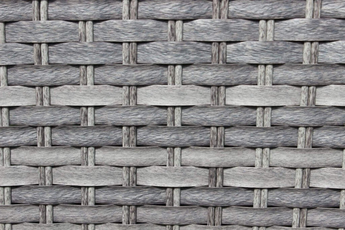 Dettaglio ravvicinato dell'intreccio in fibra sintetica grigio chiaro del salotto TENERIFE